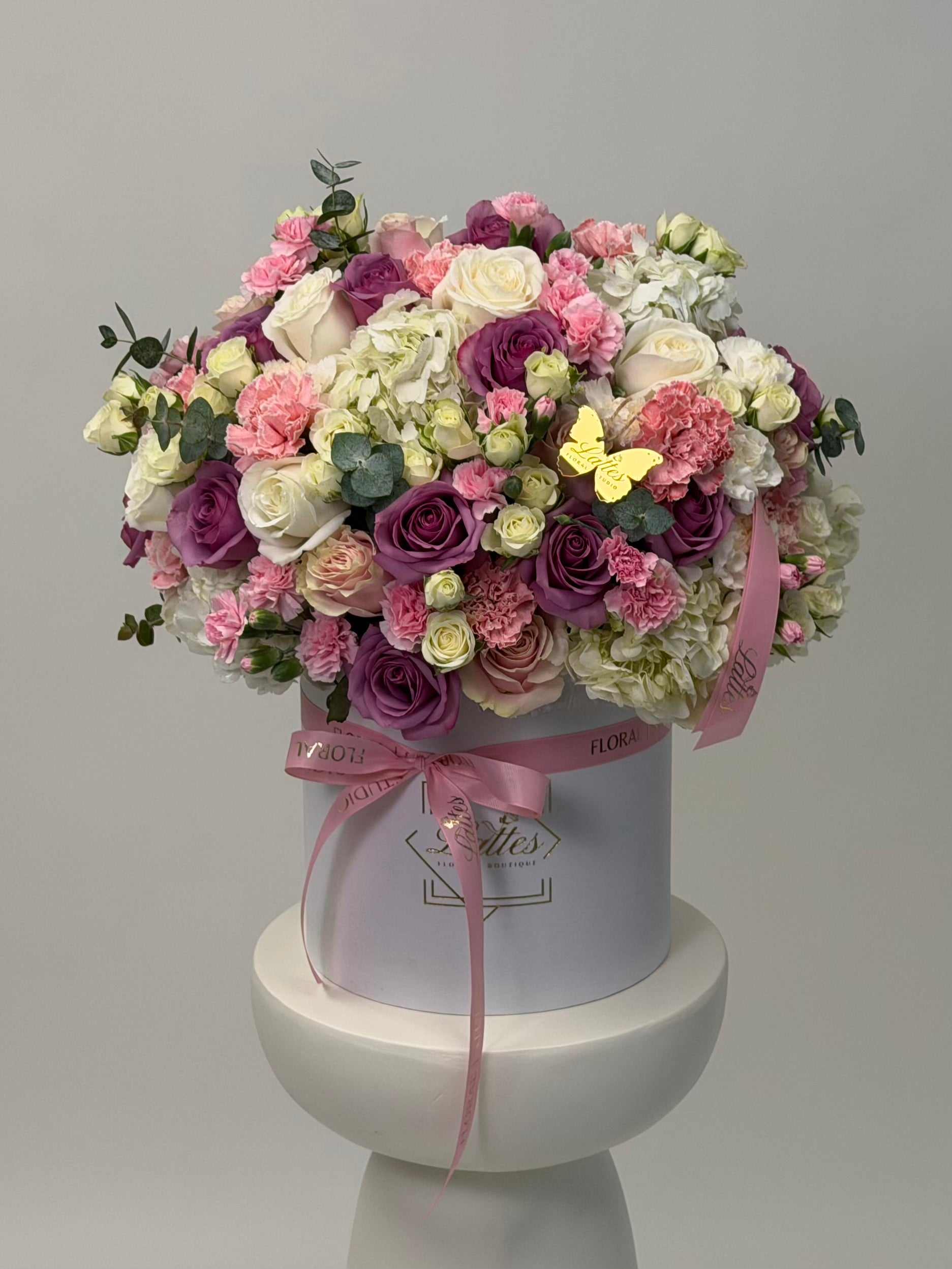 Pastel Garden flower box with lavender roses, white hydrangeas, and pink carnations in a white hat box
