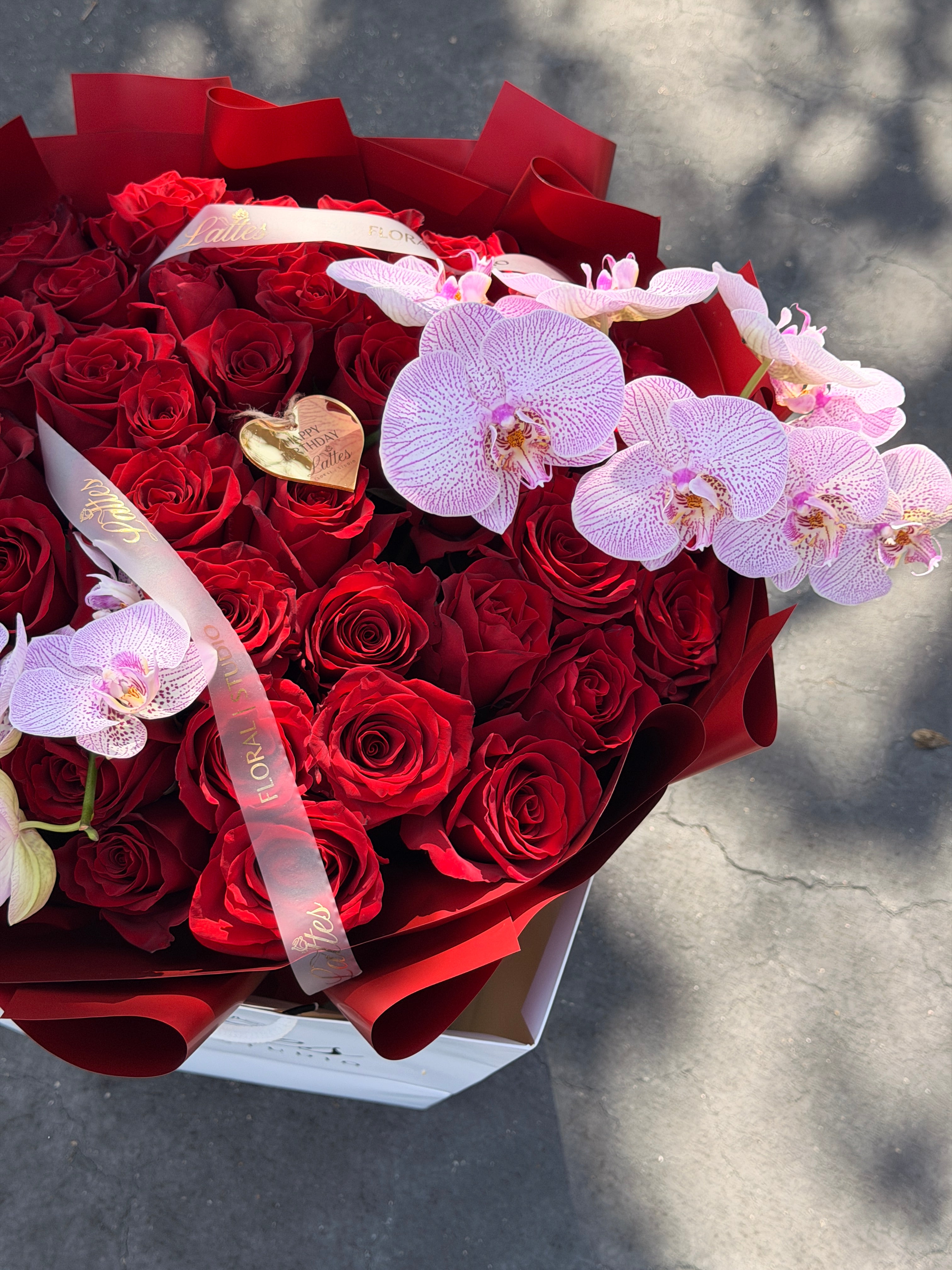 Scarlet Symphony – Red Roses with Orchids