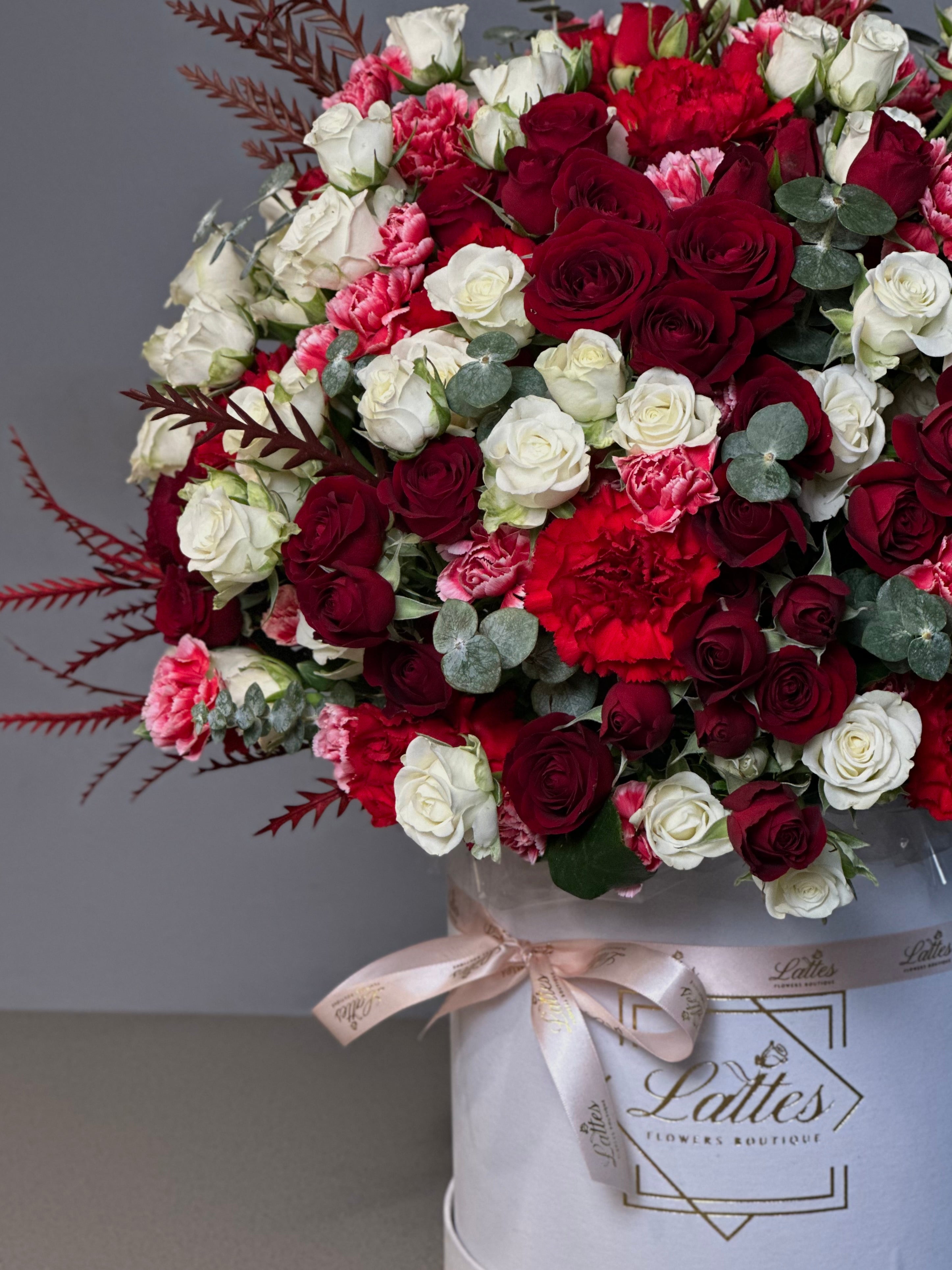 Crimson Elegance – Red and White Roses in a Flower Box