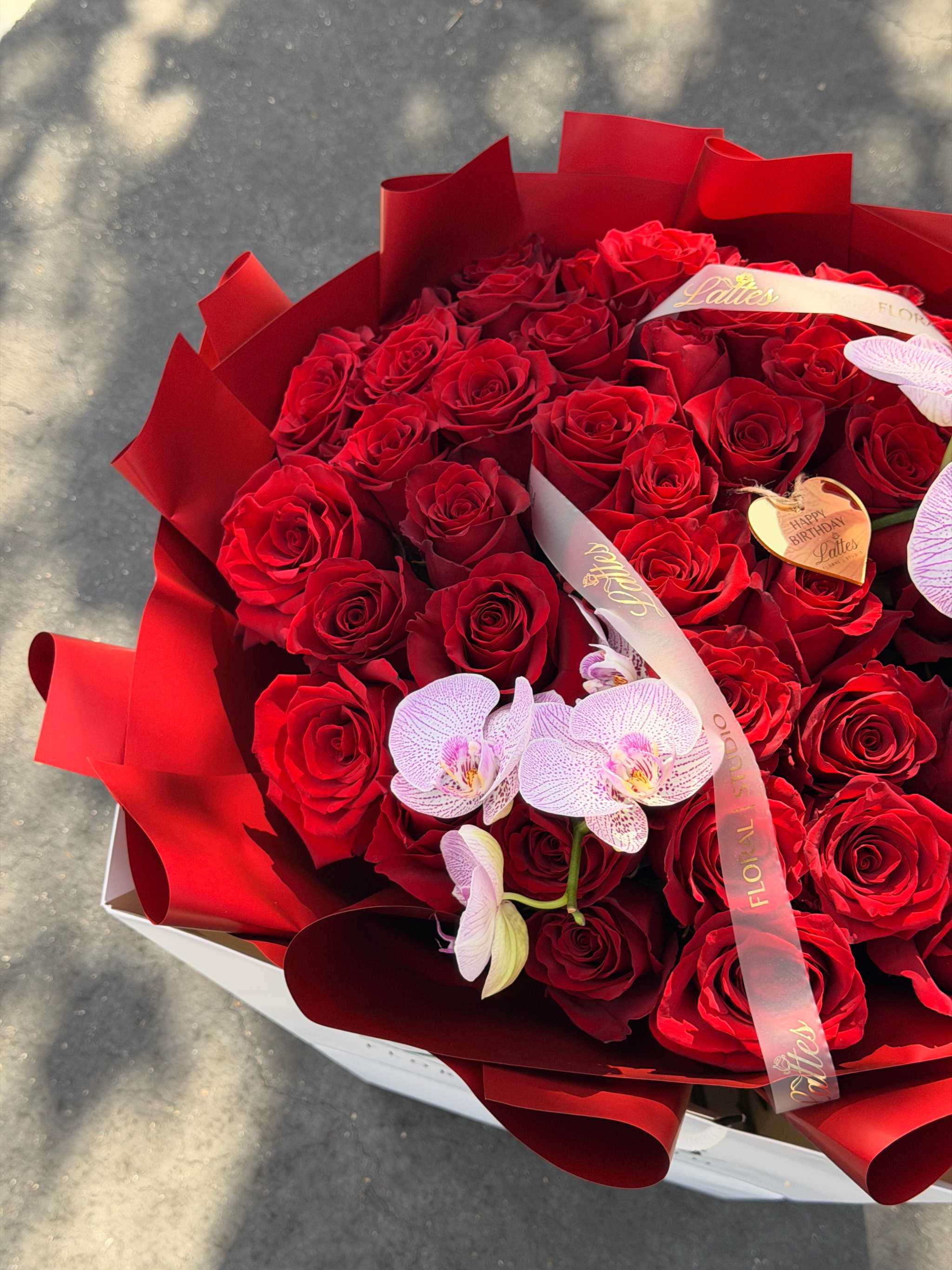 Scarlet Symphony bouquet of red roses and orchids for flower delivery orange