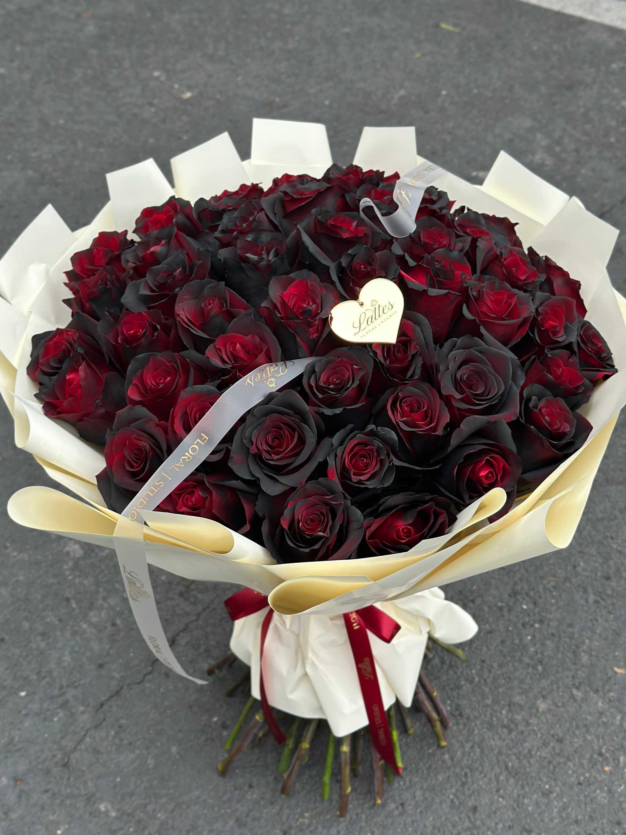 Midnight Passion Bouquet of deep red and black roses with elegant wrapping and same-day delivery