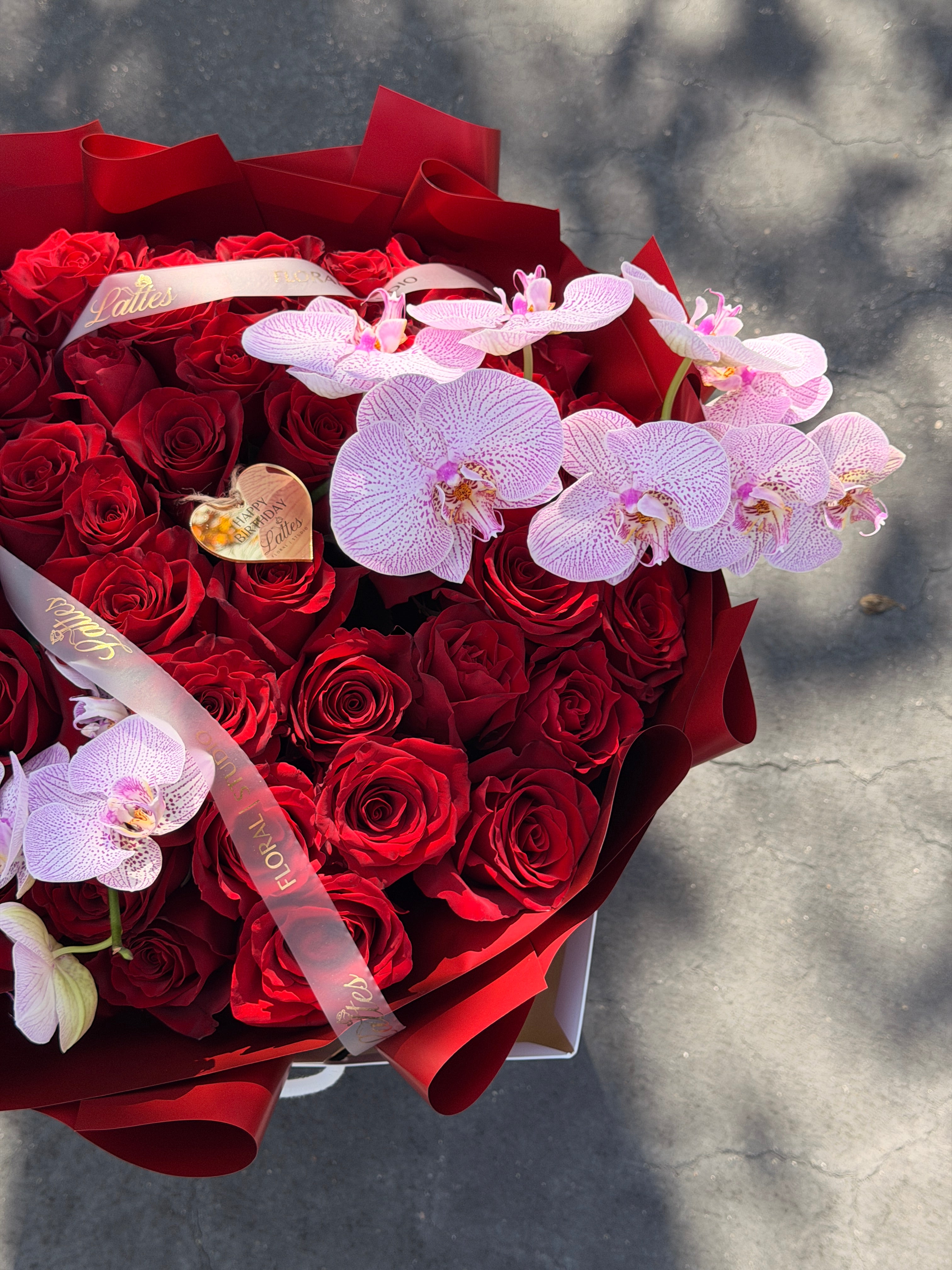 Scarlet Symphony – Red Roses with Orchids