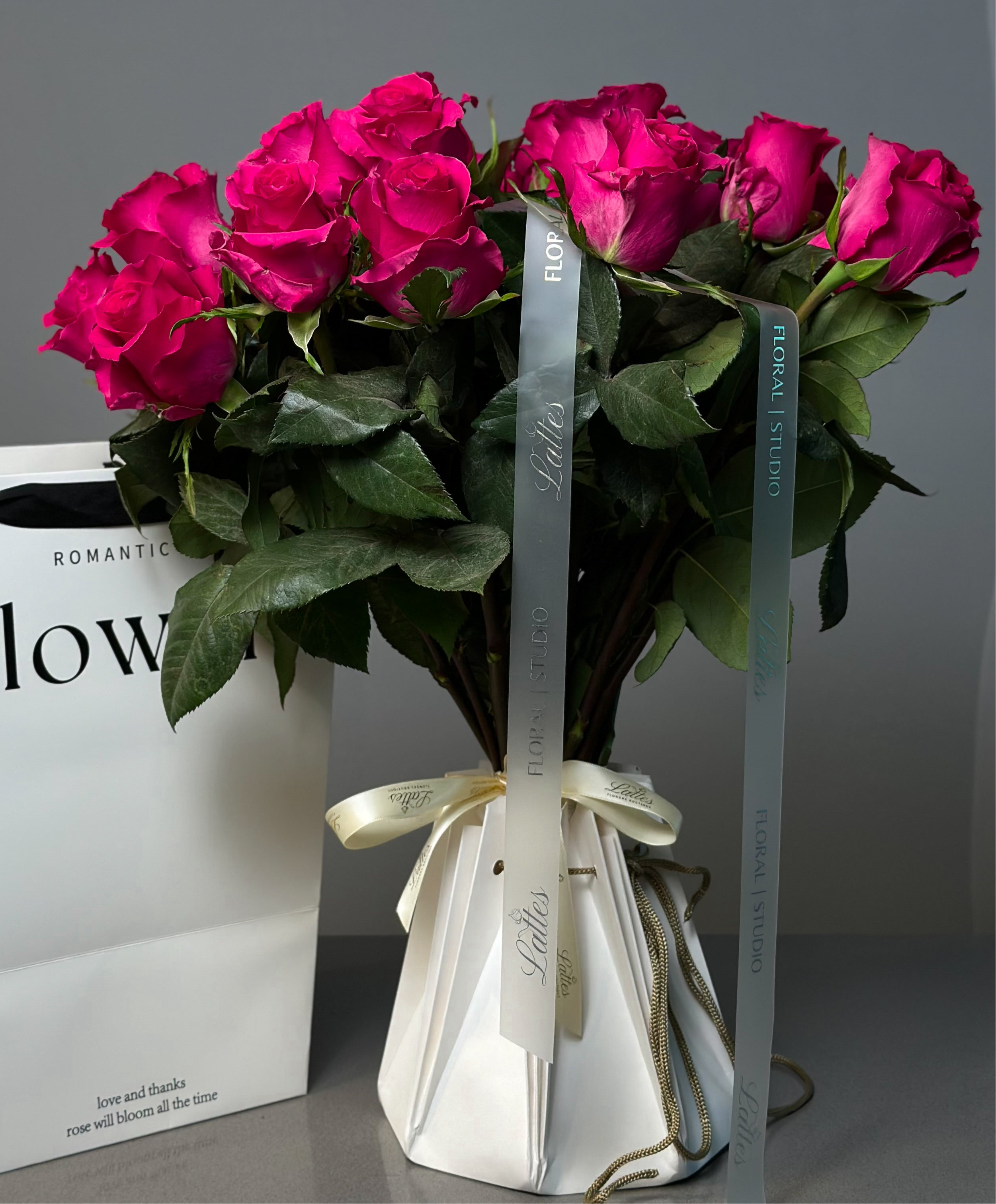 Dark Pink Roses in Aqua Vase