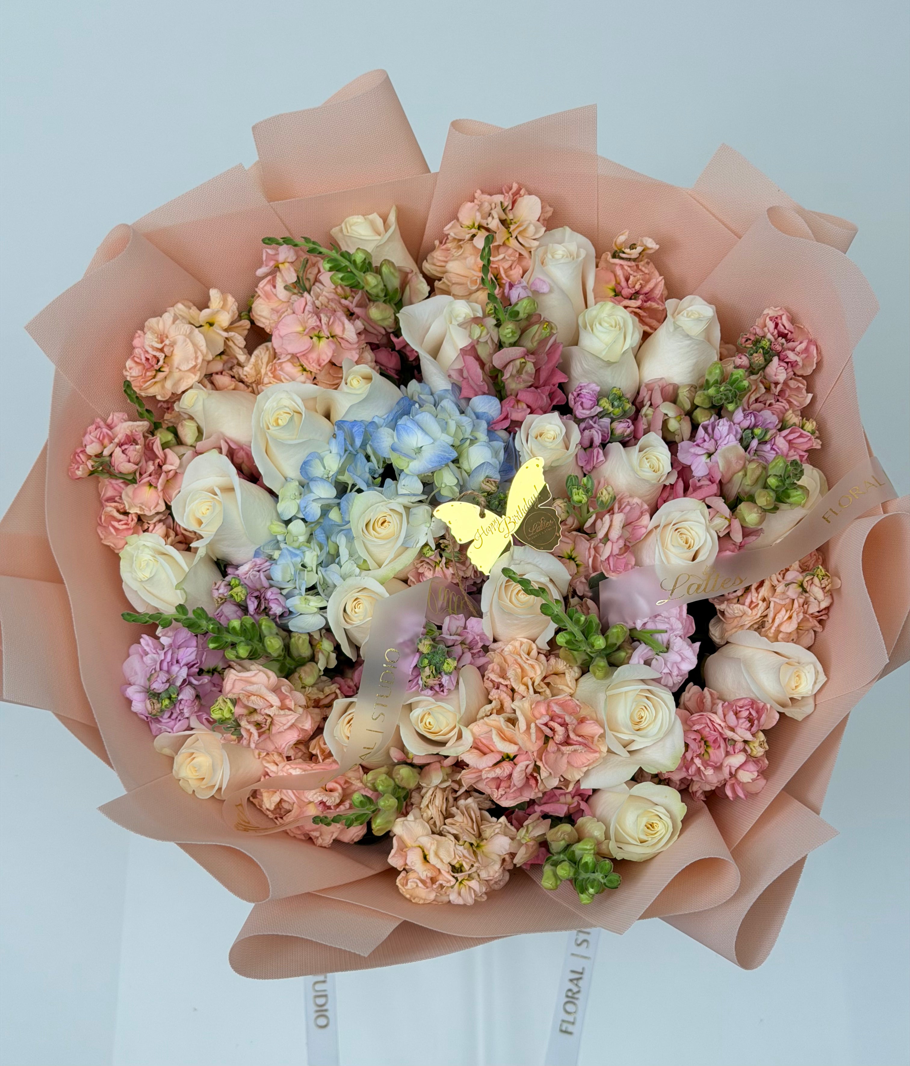 Butterfly Whispers – White Roses Blue Hydrangea & Peach Stock Bouquet