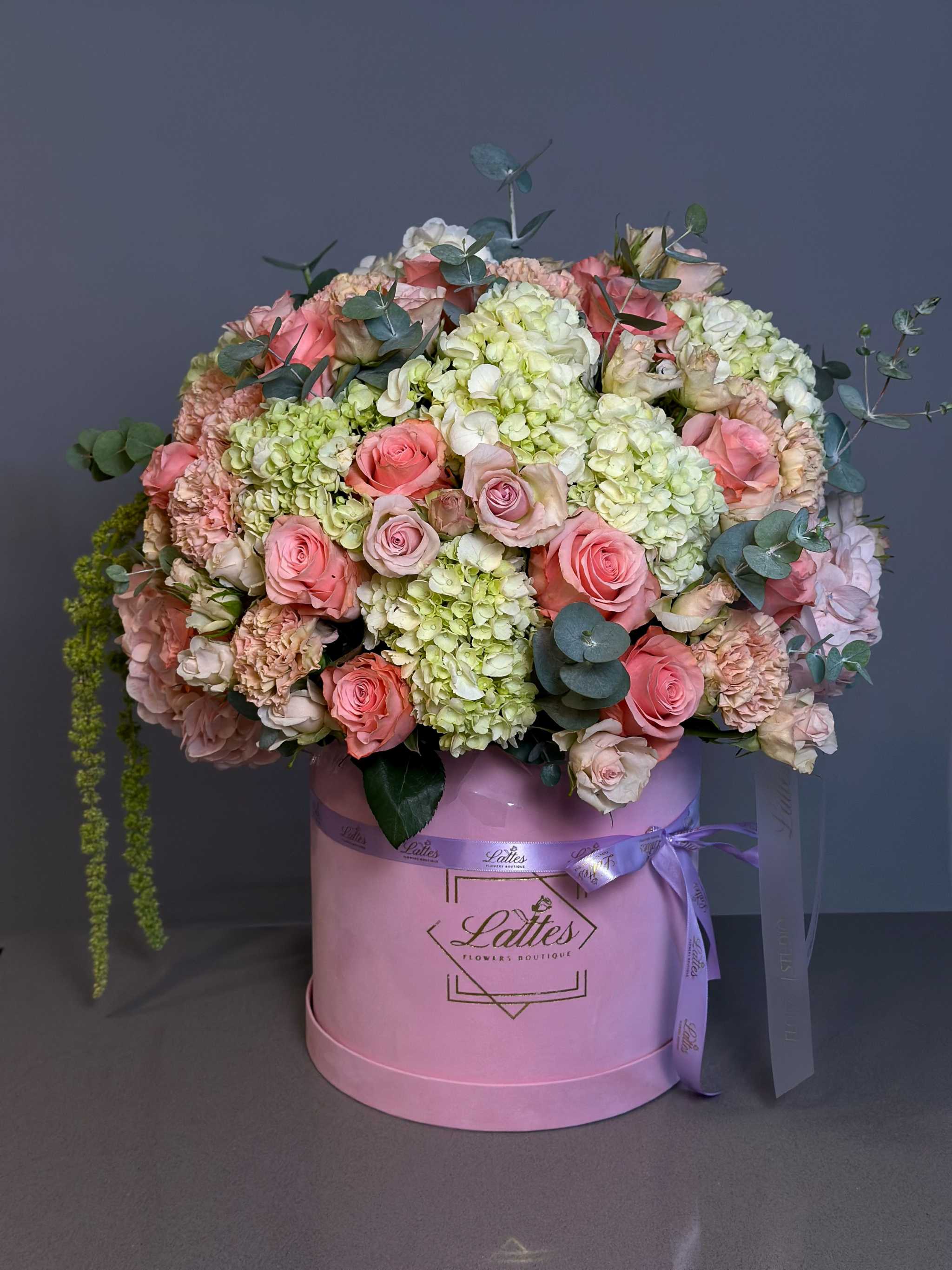 Tender Embrace Flower Box with pink hydrangeas, roses, and eucalyptus in a sleek pink box