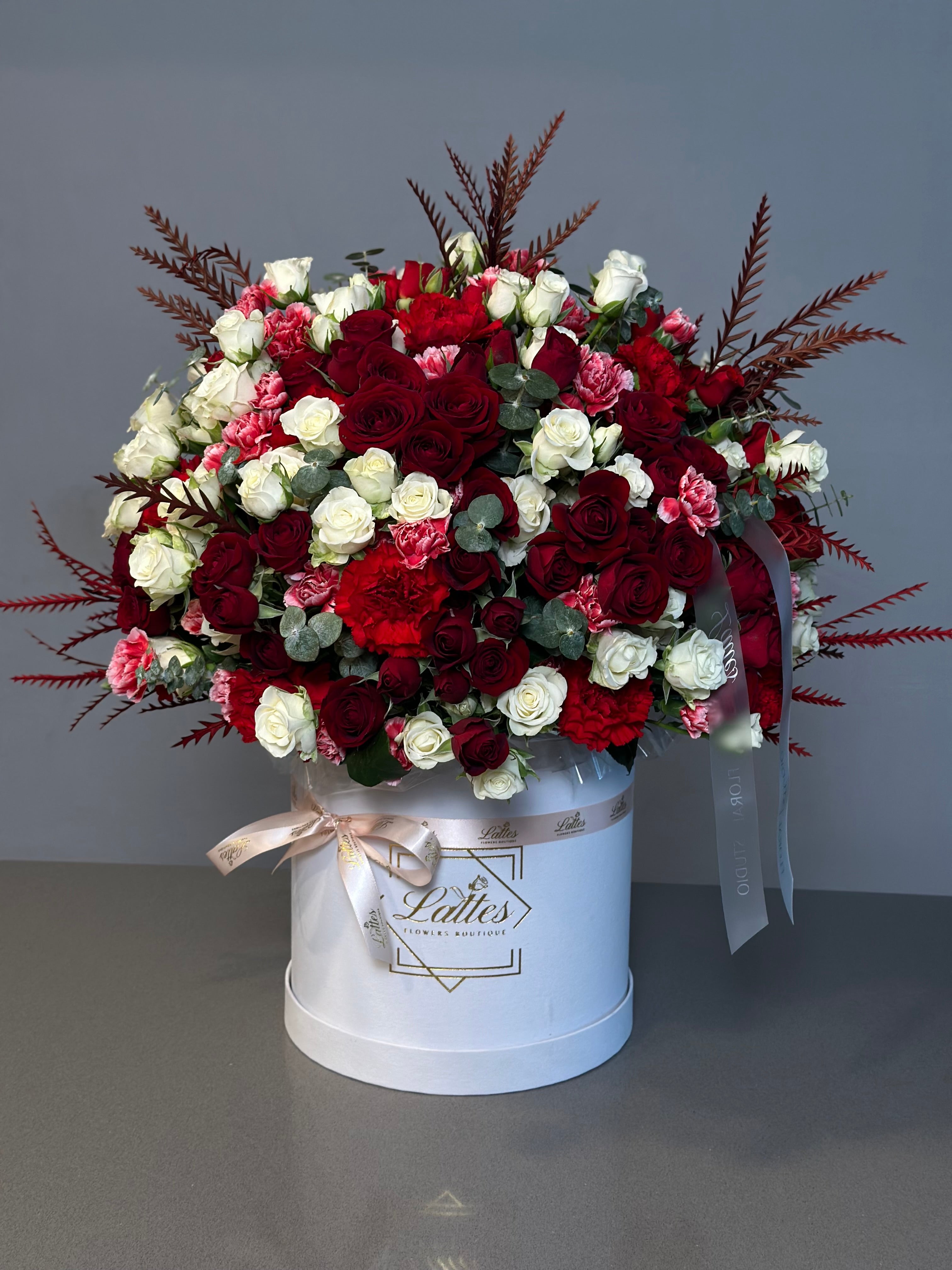 Crimson Elegance – Red and White Roses in a Flower Box