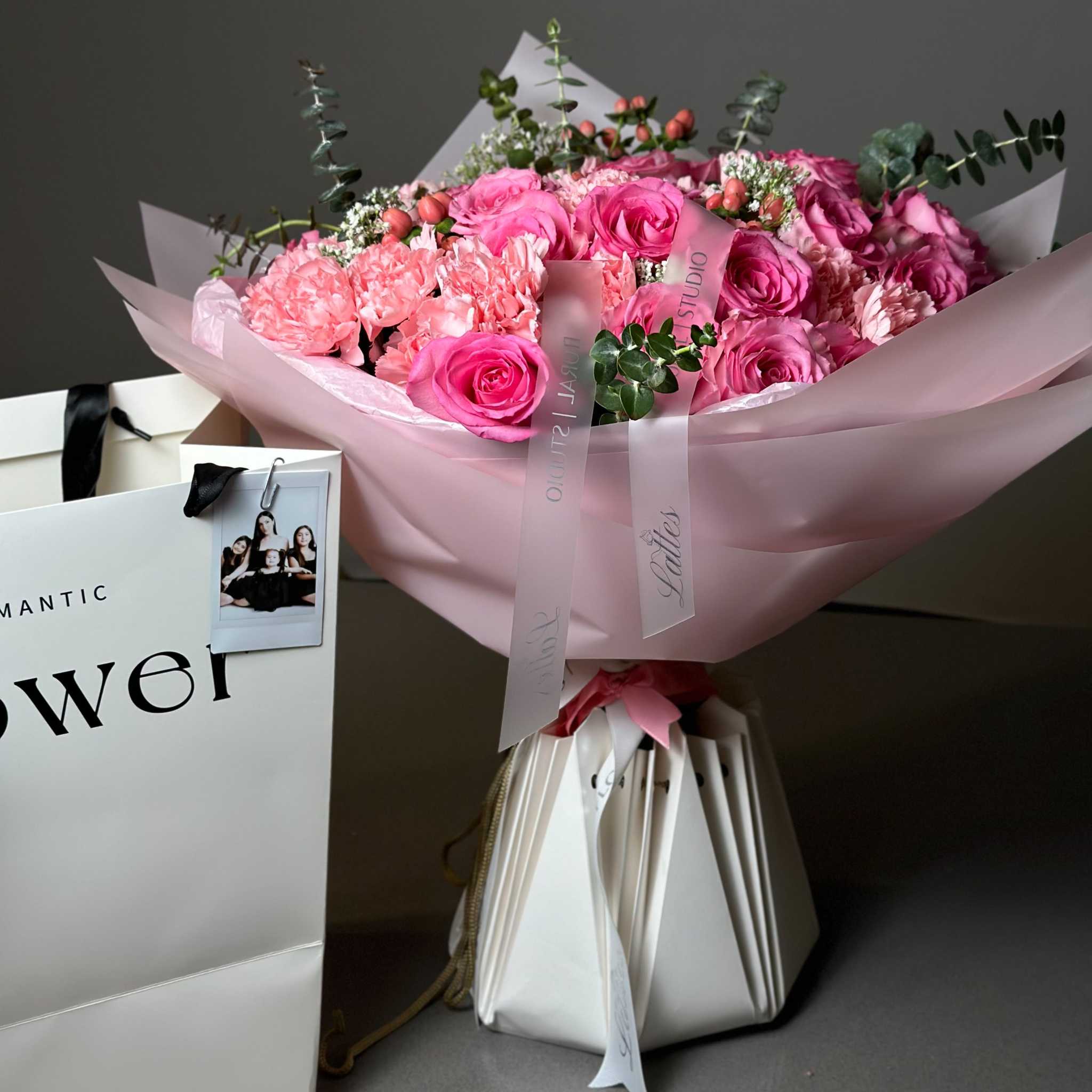 Pink Elegance Bouquet with pink roses, carnations, eucalyptus wrapped in soft pink paper for romantic occasions