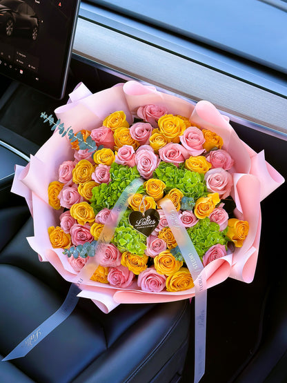 Lumiere de Provence – Bouquet of Yellow and Pink Roses with Green Hydrangeas