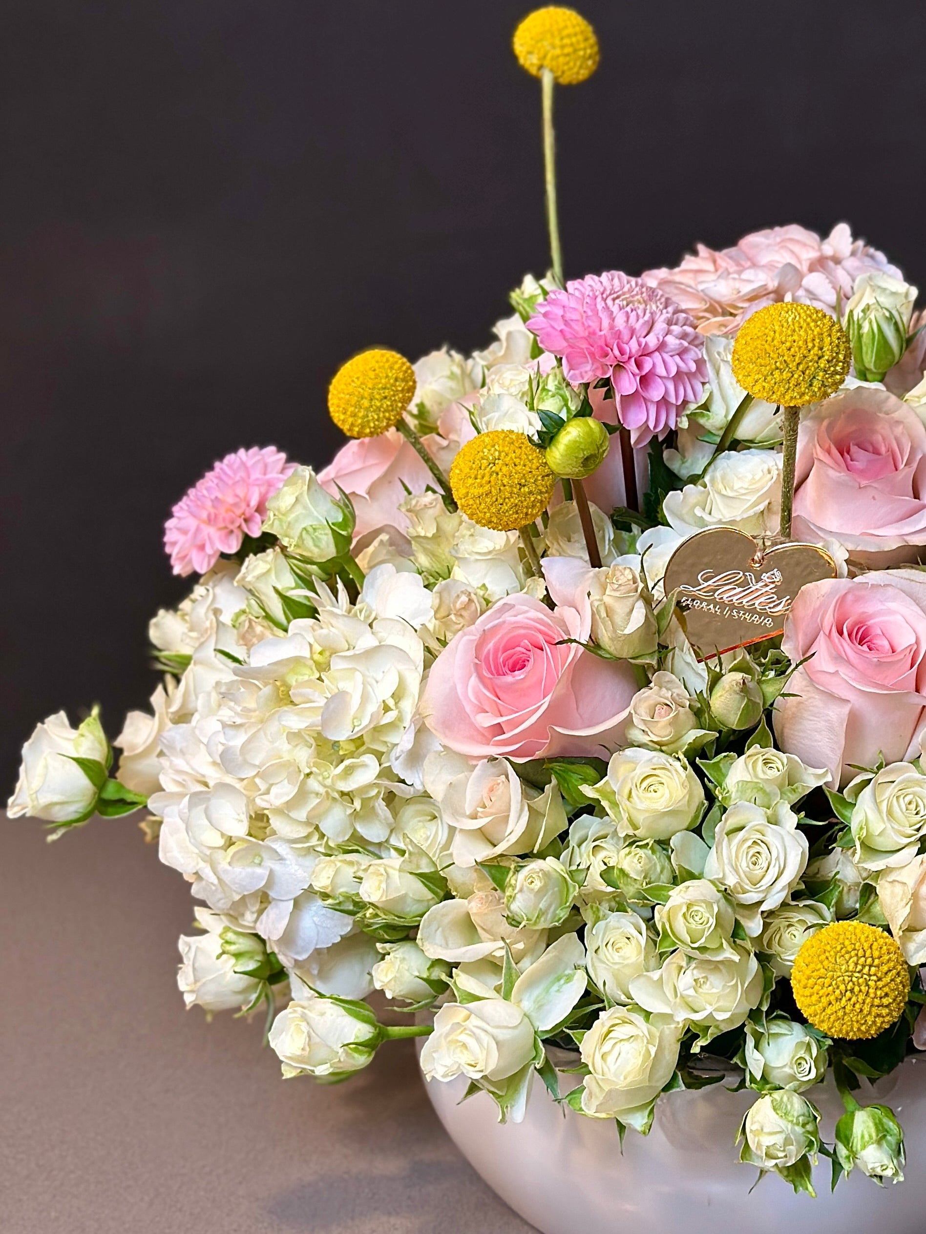 Golden Bliss Floral Arrangement – Roses, Spray Roses, Hydrangea & Craspedia