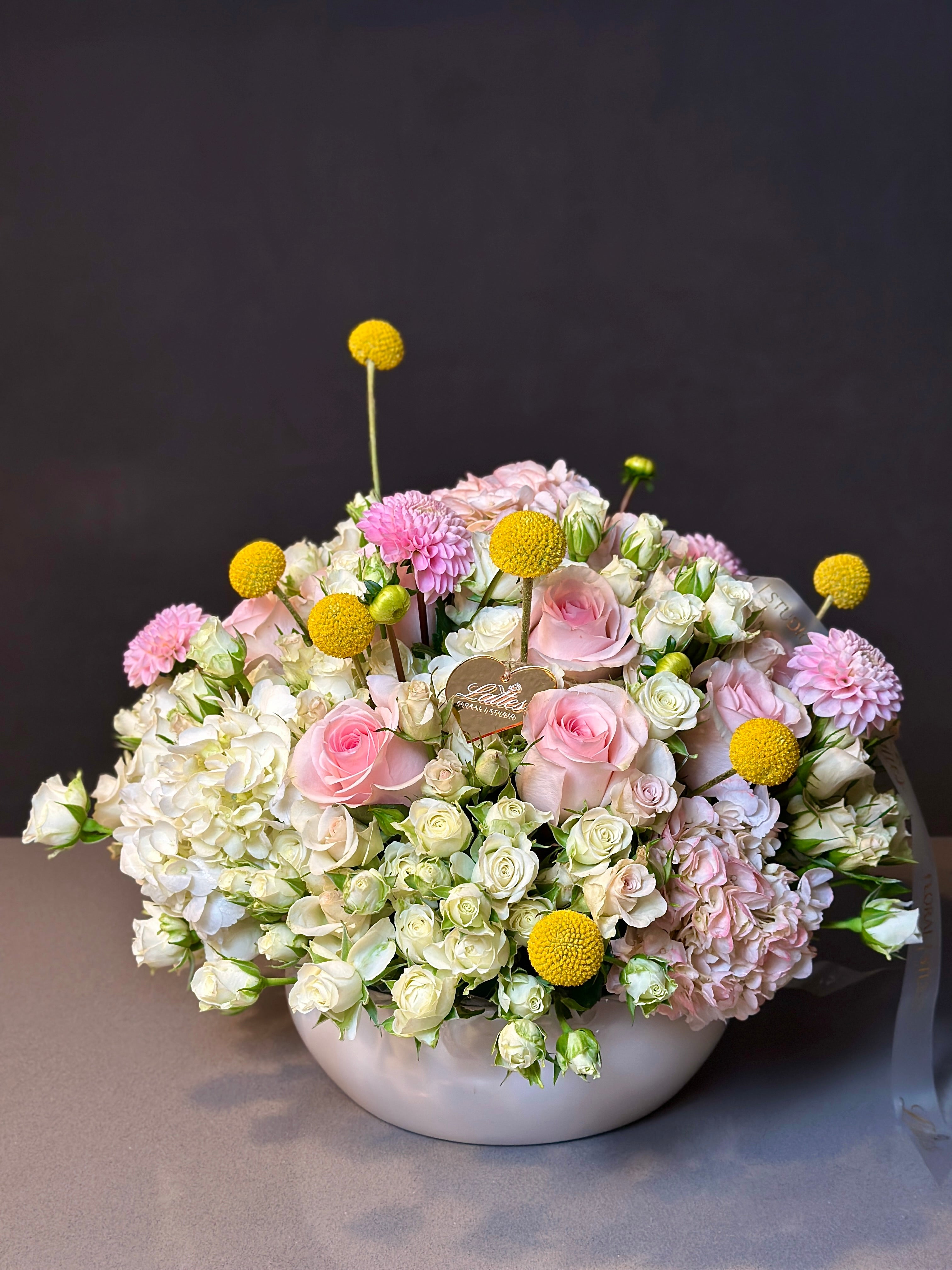 Golden Bliss Floral Arrangement – Roses, Spray Roses, Hydrangea & Craspedia