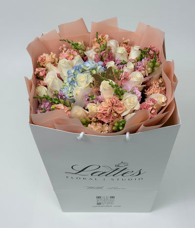 Butterfly Whispers – White Roses Blue Hydrangea & Peach Stock Bouquet