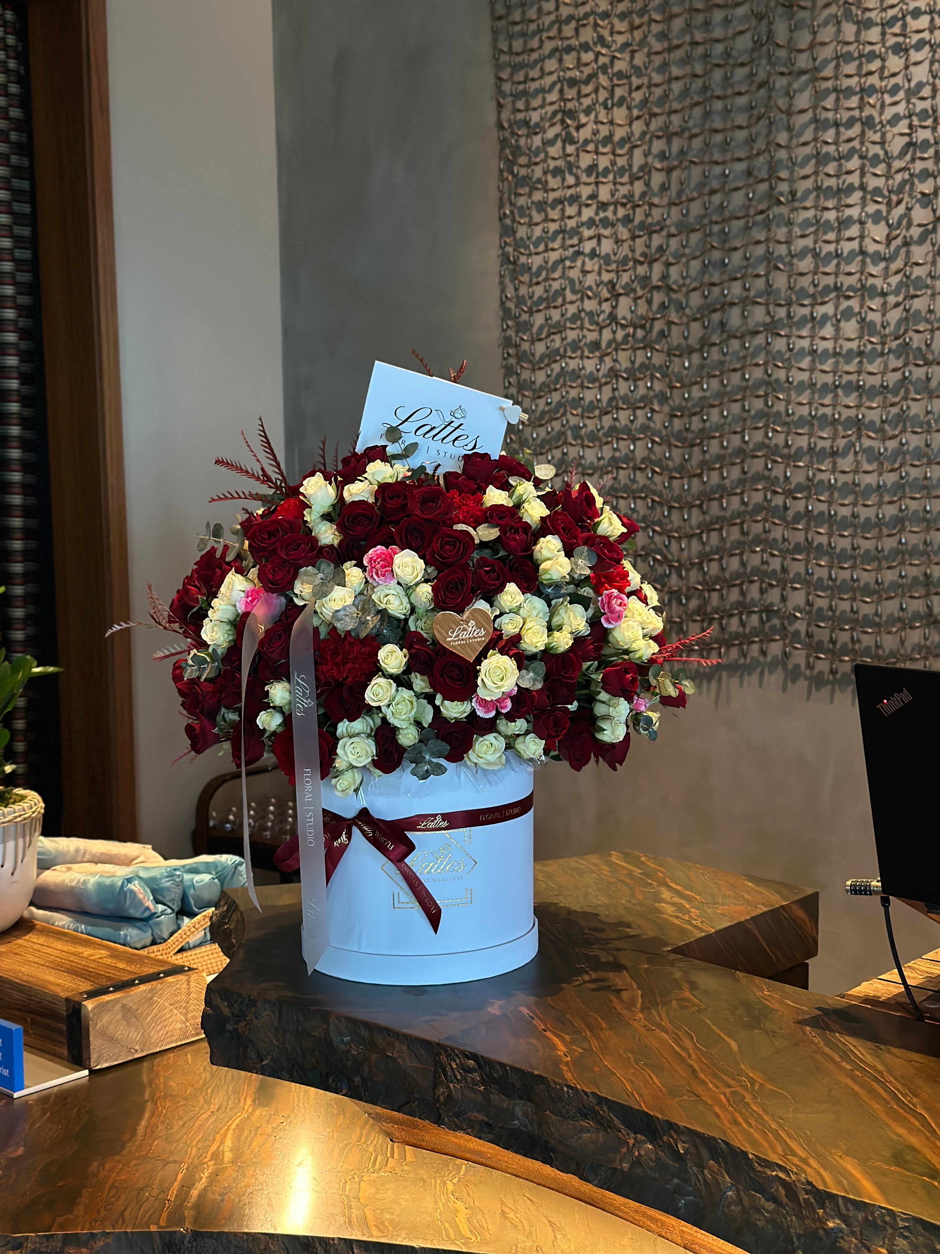 Crimson Elegance – Red and White Roses in a Flower Box