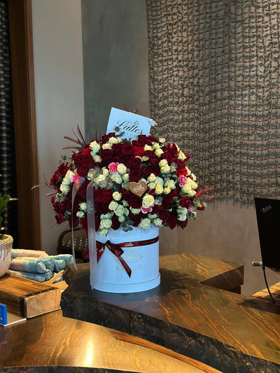 Crimson Elegance – Red and White Roses in a Flower Box