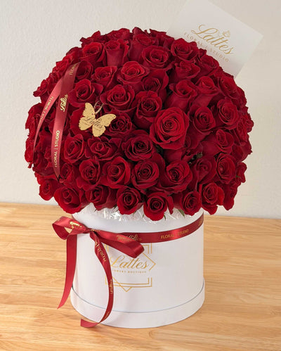 Mono red roses arranged in a matte black flower box with 75 premium long-stem roses.