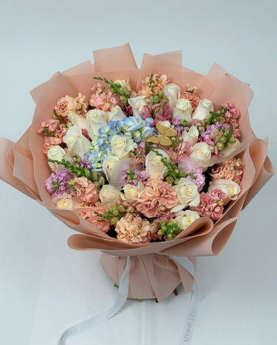 Butterfly Whispers – White Roses Blue Hydrangea & Peach Stock Bouquet