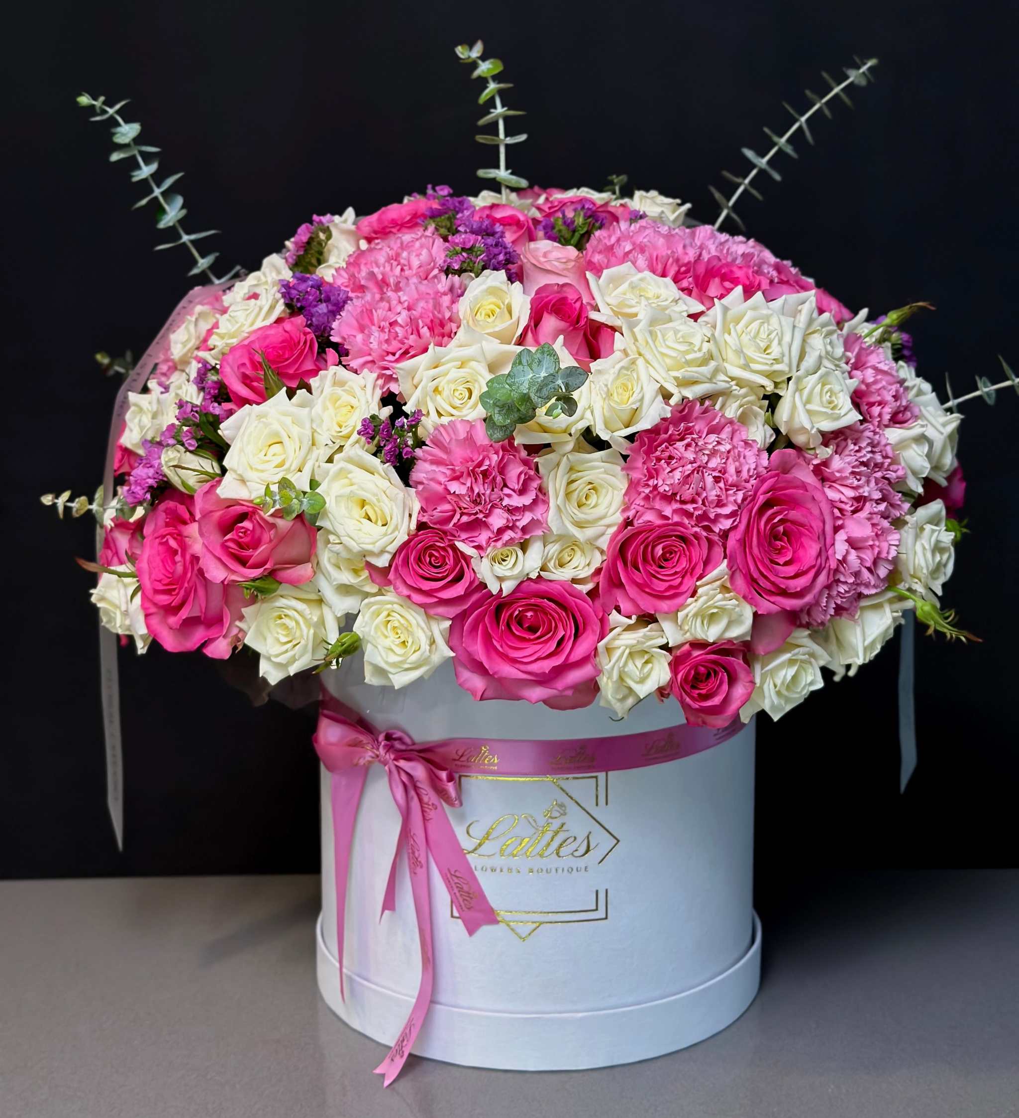 Romantica in Bloom large floral arrangement with pink and cream roses in stylish round hatbox