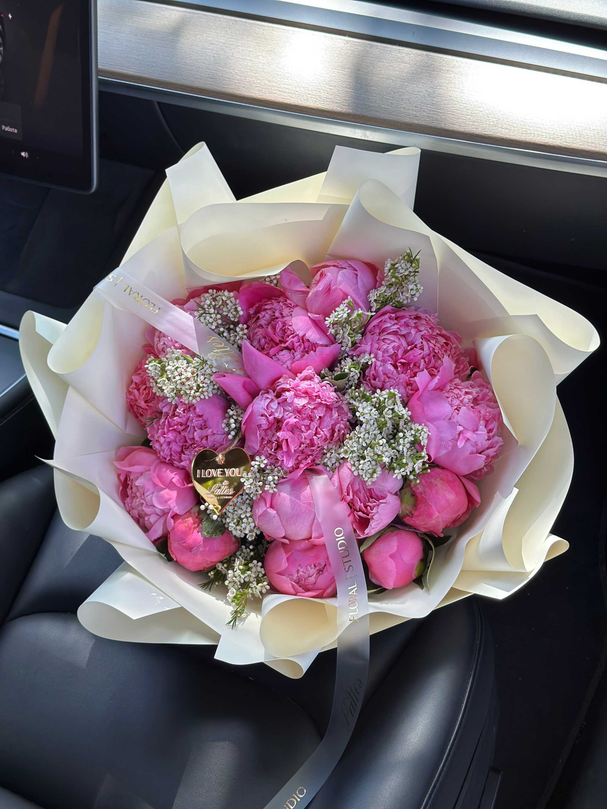 Pink Peony Crush bouquet with lush fuchsia peonies and white filler blooms wrapped in ivory paper