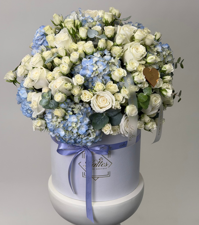 Heavenly Blues blue hydrangeas and white roses flower box with eucalyptus and lavender ribbon