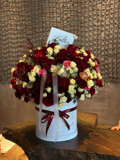 Crimson Elegance – Red and White Roses in a Flower Box