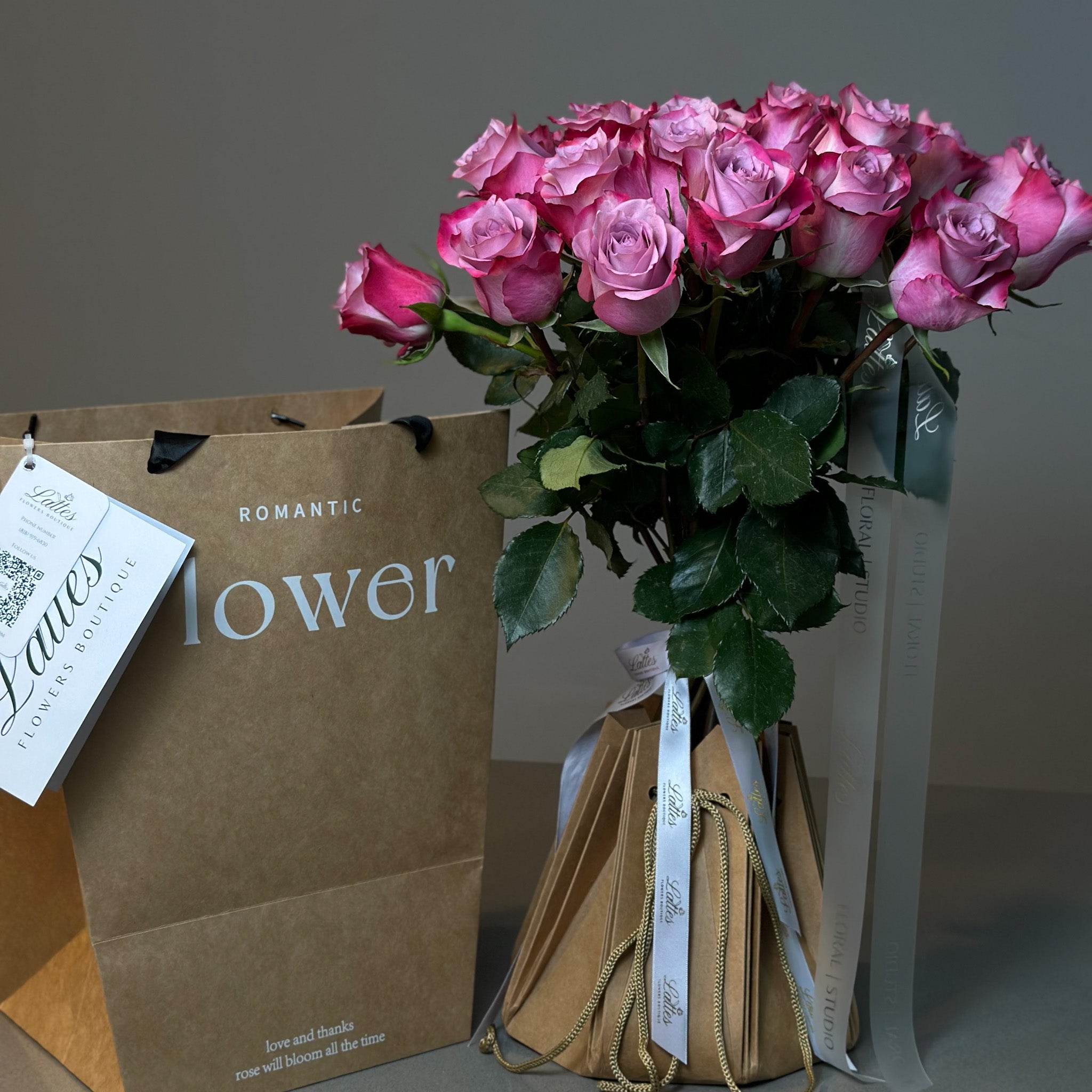 Purple Roses in Aqua Vase